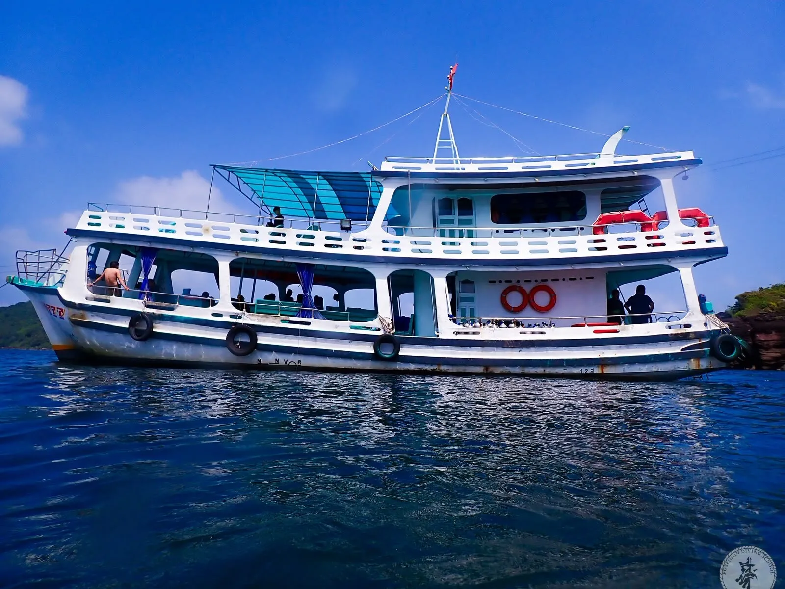 Poseidon Diving School dive boat anchored in the sea off Phu Quoc under a blue sky