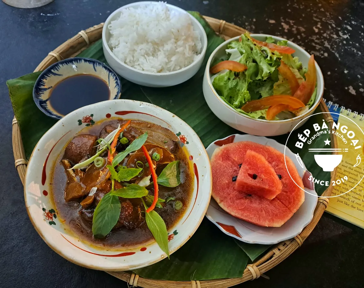 5 Spices Duck served with rice, salad and dipping sauce on a banana leaf tray at Grandma's Kitchen in Phu Quoc
