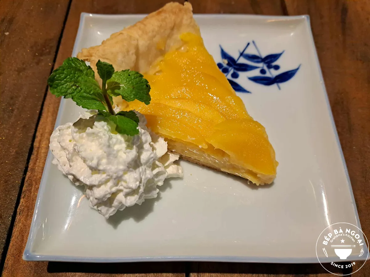 Fresh Mango Pie with whipped cream and mint